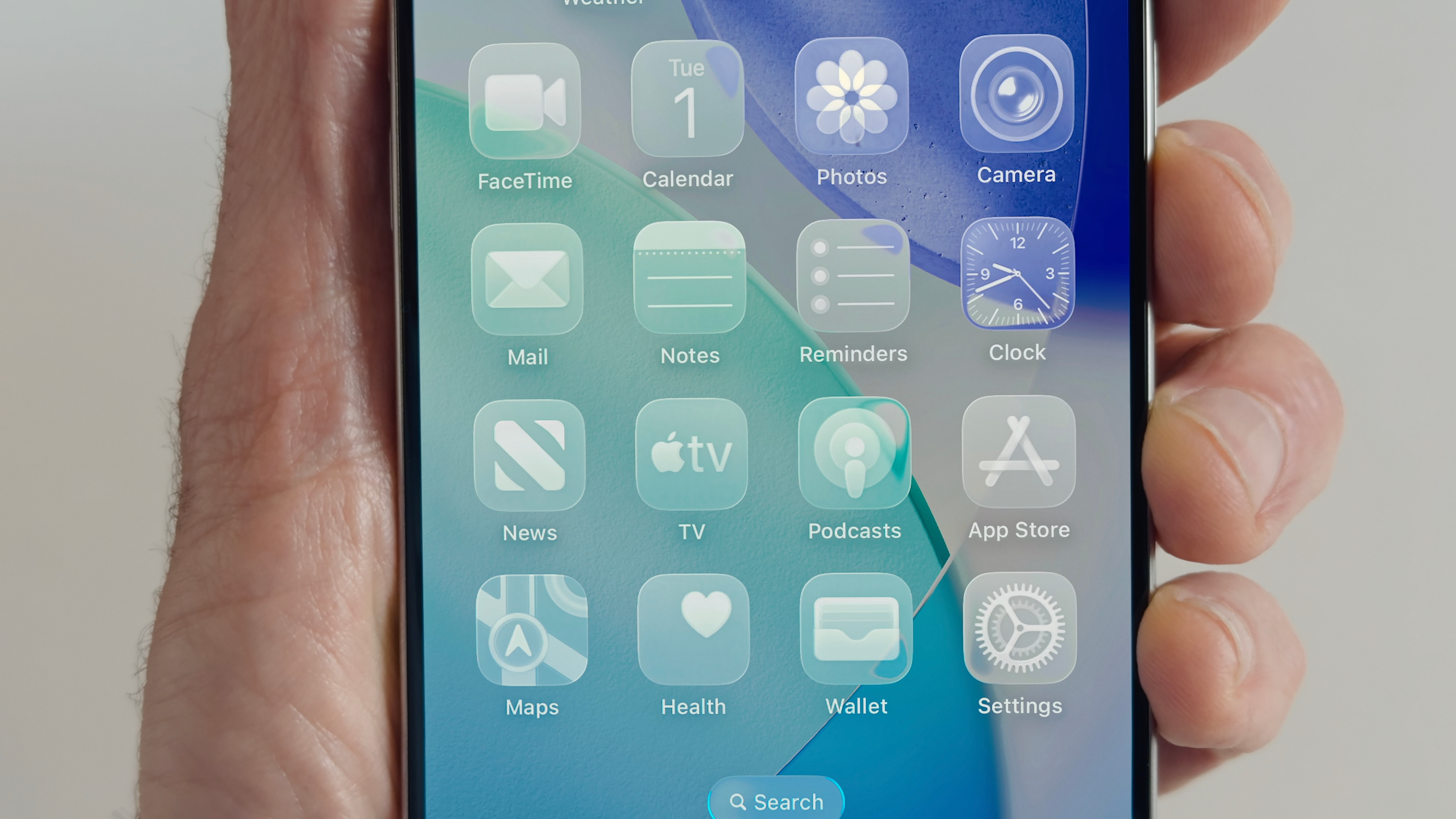 Close-up of Apple’s Liquid Glass UI on iOS 18 with translucent app icons